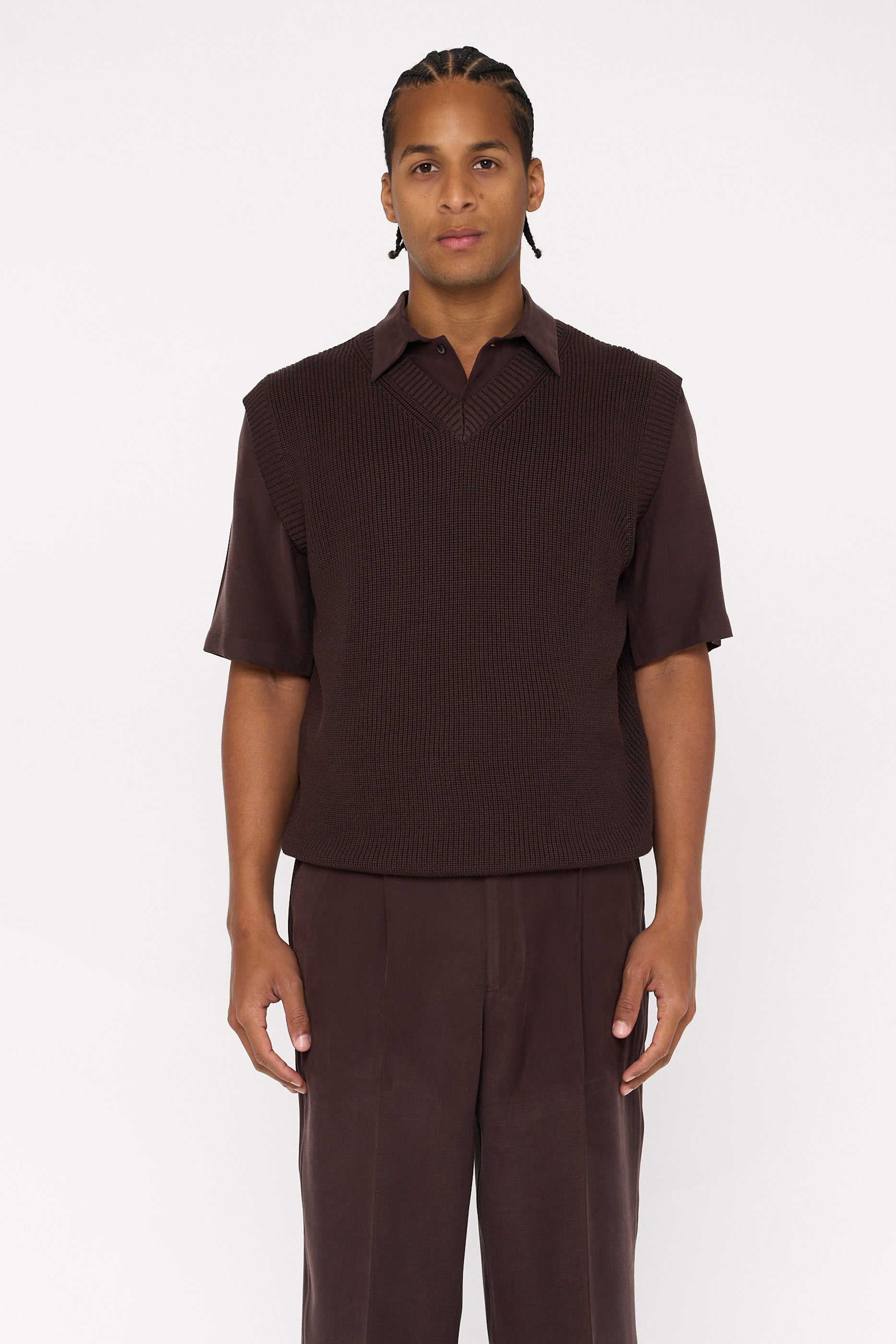 Maroon brown cotton and lyocell knit vest with a relaxed fit, worn over a shirt.